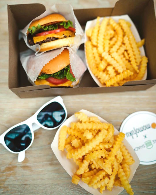 two burgers, two fries, and white sunglasses