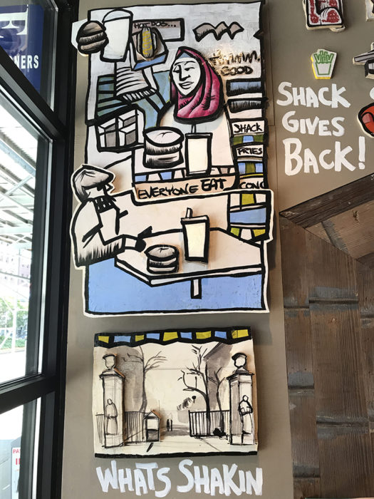 Close up shot of Artist Leon Johnson's array of work on the Morningside Heights Shack wall