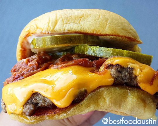 Roker Burger being held in hand