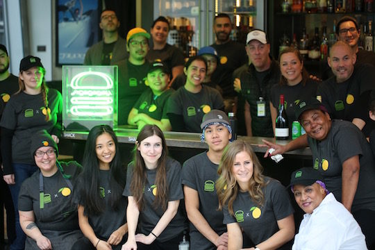 shake shack employees smiling for a group photo