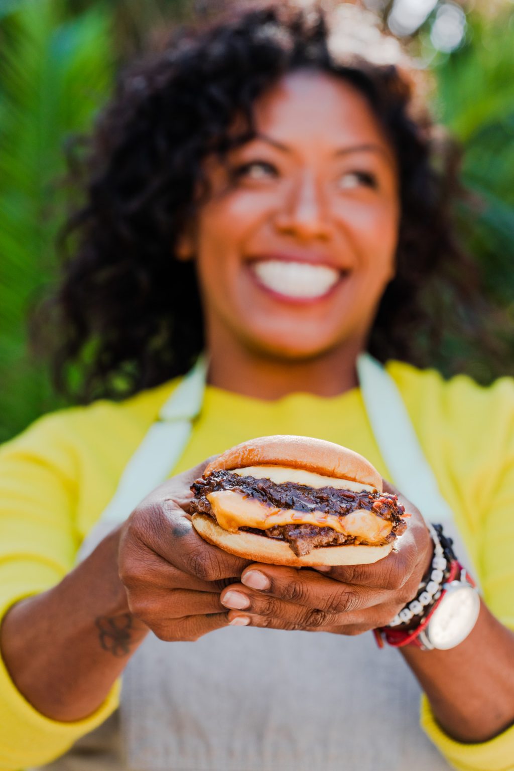 Nyesha Arrington holding the Aisoon Burger