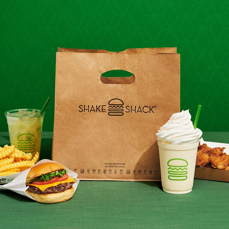 Shake Shack to-go bag with burger, shake and fries